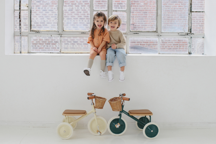 two kids trikes with basket