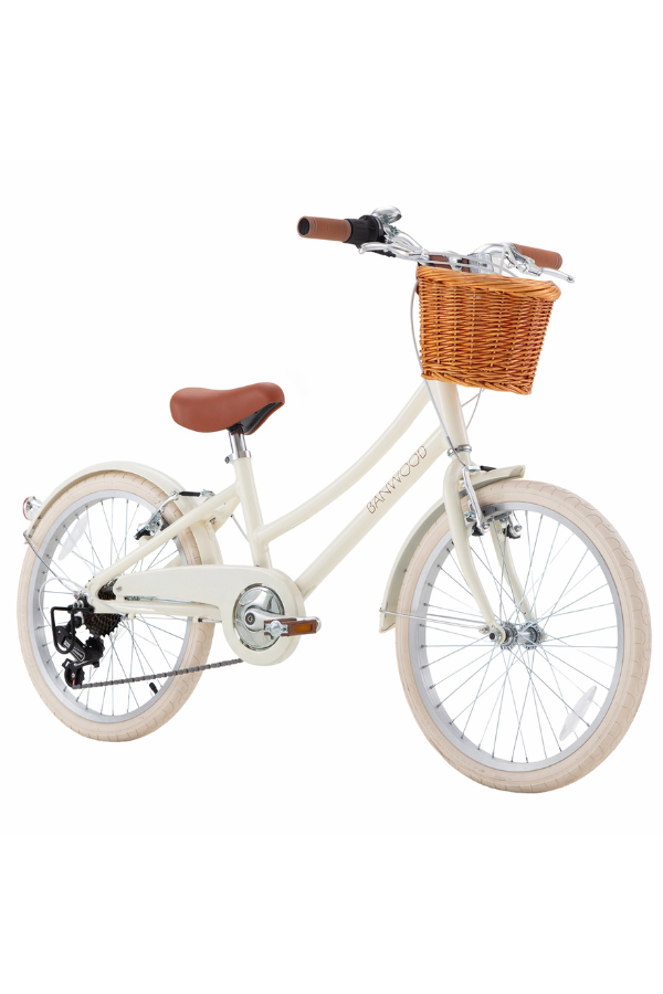 vintage bicycle in cream color with basket