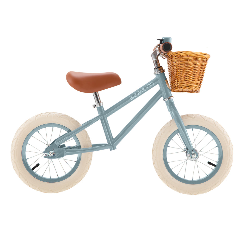 12 inch balance bike in teal color with wicker basket
