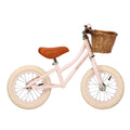 kids balance bike with pink frame and basket
