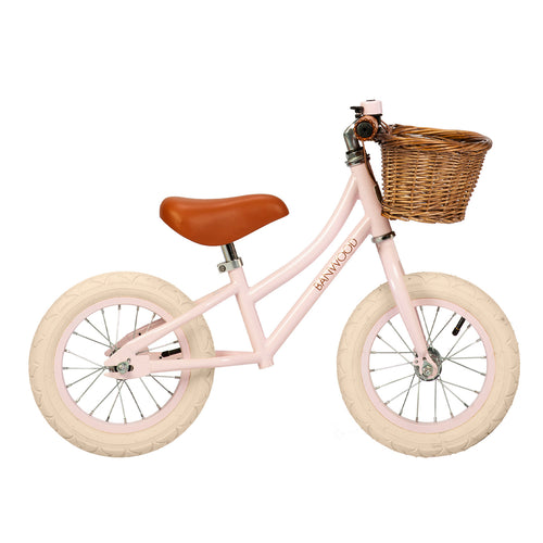 kids balance bike with pink frame and basket