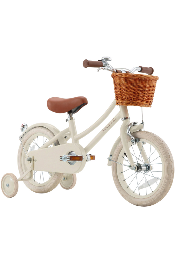 cream kids bicycle with training wheels and basket
