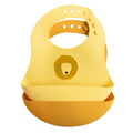 silicone bib in yellow with lion print 2 pack